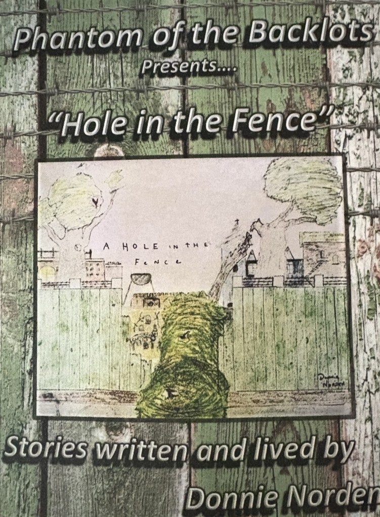 Cover of 'Phantom of the Backlots' presenting 'Hole in the Fence', featuring an illustration of a fence with a hole, trees, and a house. Text includes 'Stories written and lived by Donnie Norden'.