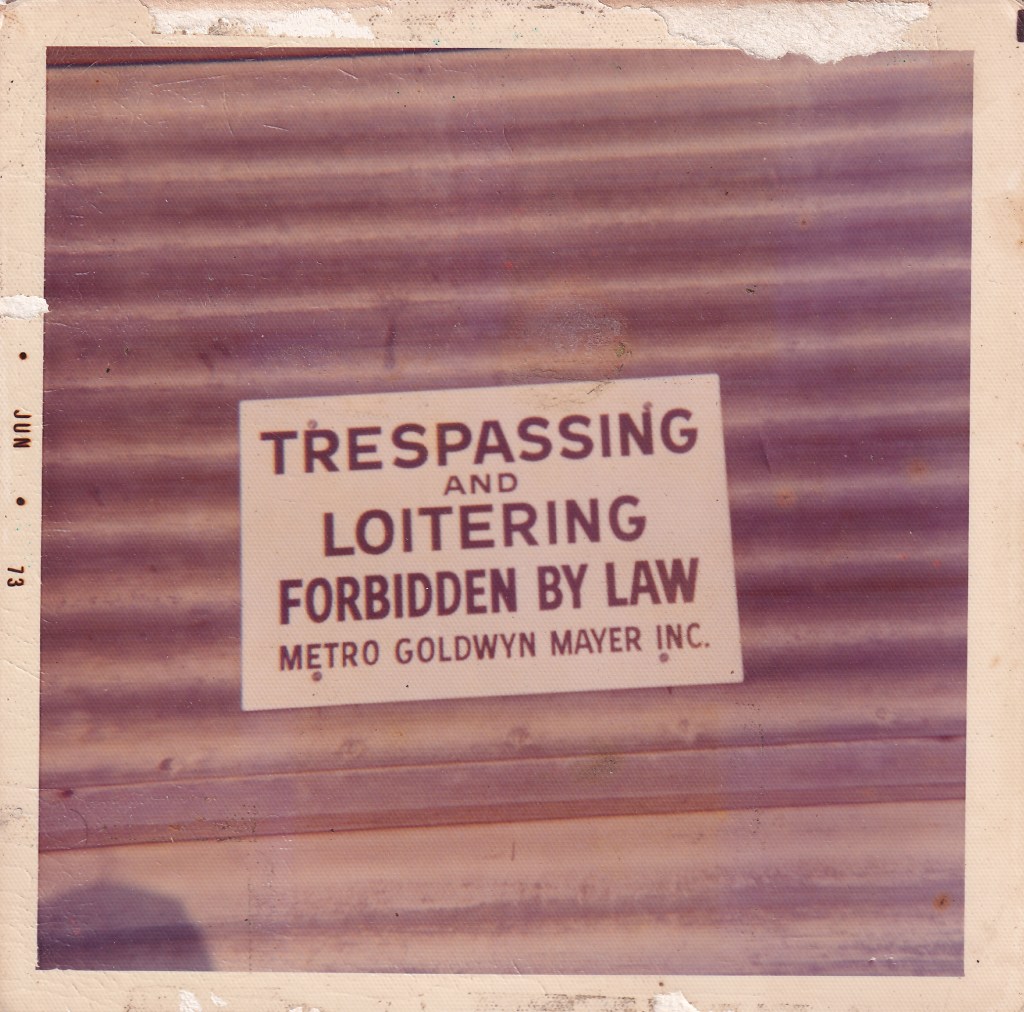 Sign stating 'TRESPASSING AND LOITERING FORBIDDEN BY LAW' from Metro Goldwyn Mayer Inc.