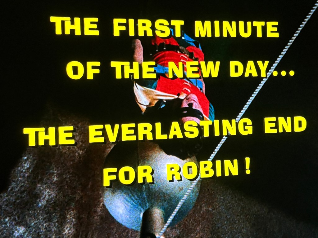A dramatic title card featuring the text 'THE FIRST MINUTE OF THE NEW DAY... THE EVERLASTING END FOR ROBIN!' in bold yellow letters against a dark background.