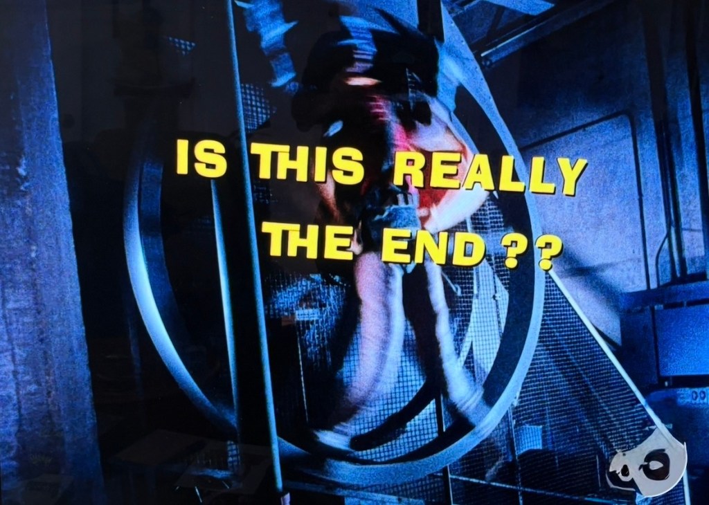 A scene featuring bold text that reads 'IS THIS REALLY THE END ??' over a blurred background, suggesting a dramatic or suspenseful moment.