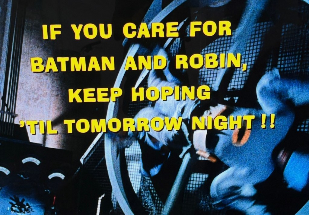 Text on screen stating, 'If you care for Batman and Robin, keep hoping 'til tomorrow night !!' with a dramatic background.
