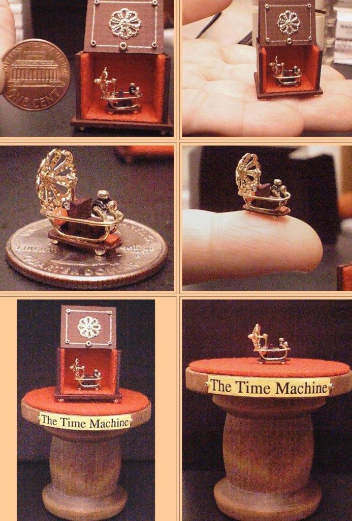 A miniature time machine inside a small box, held next to a coin for scale.