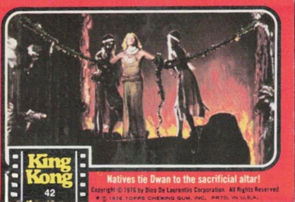 Scene from King Kong depicting natives tying a woman named Dwan to a sacrificial altar with flames in the background.